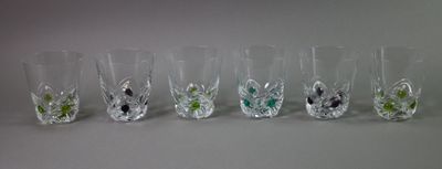 six glasses that are lined up in a row