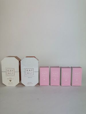 three boxes of soap sitting next to each other on a table
