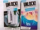 two boxes of unlock cigarettes sitting on a table