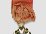 an image of a gold medal with a star on it