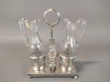 three glass vases sitting on a silver tray