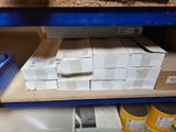 a shelf with boxes and cans on it in a store