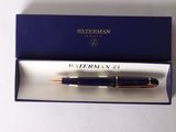 the pen is in a blue box with a gold trim