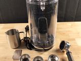 a blender and measuring cups sitting on a table
