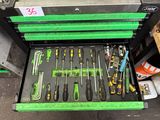 a green tool box with many tools inside of it