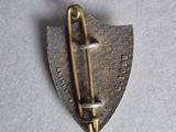 an image of a metal pin with a safety pin on it