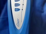 a close up of a remote control on a blue blanket