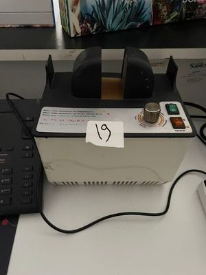 a laptop computer sitting on top of a desk next to a keyboard