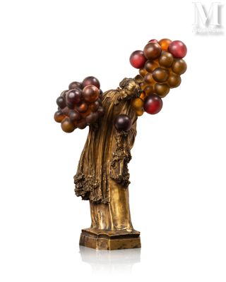 an image of a statue of a woman holding a bunch of grapes