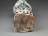 an image of a close up of a small vase with a bird on it