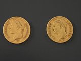 two gold sovereigns, one with the head of a man and one with a woman