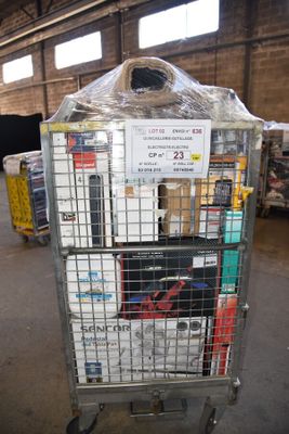 a cart with a lot of items in it in a warehouse