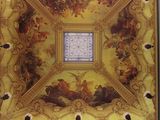 painting on the ceiling of a building with a skylight in the center