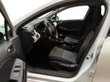 the interior of a car with the door open and the driver ' s seat down