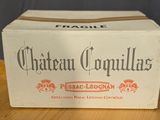 a box that is sitting on top of a wooden barrel