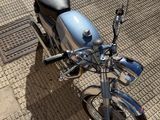 a motorcycle that is parked on the side of the street