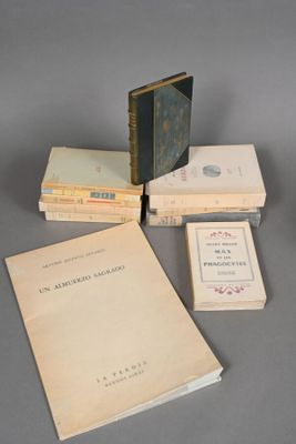 several books are stacked on top of each other on a table
