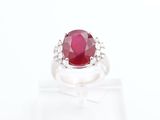 an oval ruby and diamond ring