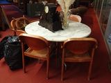 a table with a clock on it in the middle of a room