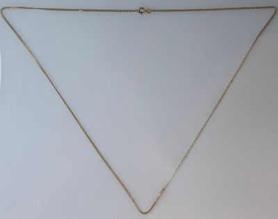 a necklace with a gold chain and a gold pendant on a white background
