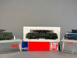 three toy trains that are on display on a table