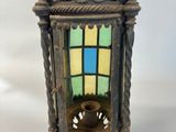 a small lantern that is hanging from the ceiling