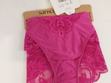 a close up of a pink panties with a tag on it