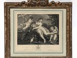 a framed picture of a woman and two children in a wooded setting