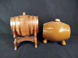 two wooden barrels sitting next to each other on a black background