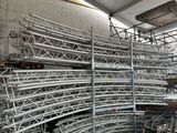 a large pile of metal pipes in a warehouse
