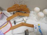 a lot of wooden hangers that are on a table