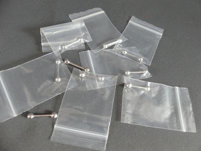 a lot of small plastic bags with screws on them