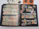 many different stamps in a folder on the table