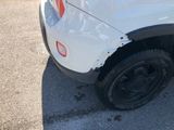 a close up of a tire on a white truck