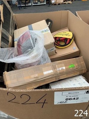 a cardboard box full of boxes and a helmet in it