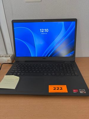 a laptop computer sitting on a desk with a price tag on it