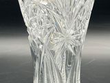 a glass vase that is sitting on a table