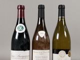 three bottles of wine sitting next to each other on a table