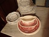 a table with plates and bowls on it in the kitchen
