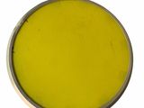 yellow paint in a metal container with a spoon on a white surface