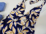 a blue and yellow dress and a pair of blue shoes