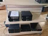 a shelf that has many electronics on it