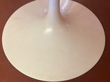an image of a white table with a glass top
