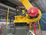 a robot that is sitting on top of a yellow box