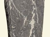 a black and white marble vase on a white background