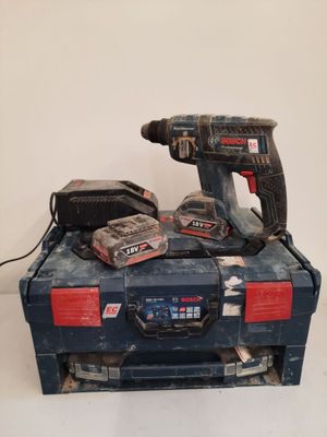 two tools that are sitting on top of a tool box