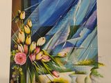 two pictures of a vase of flowers and a vase of flowers on a table