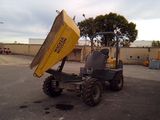 a dump truck that is sitting in the middle of a parking lot