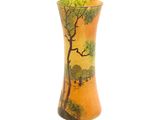 an orange vase with a painting of a tree on it