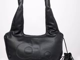 a black leather bag with a logo on the front
